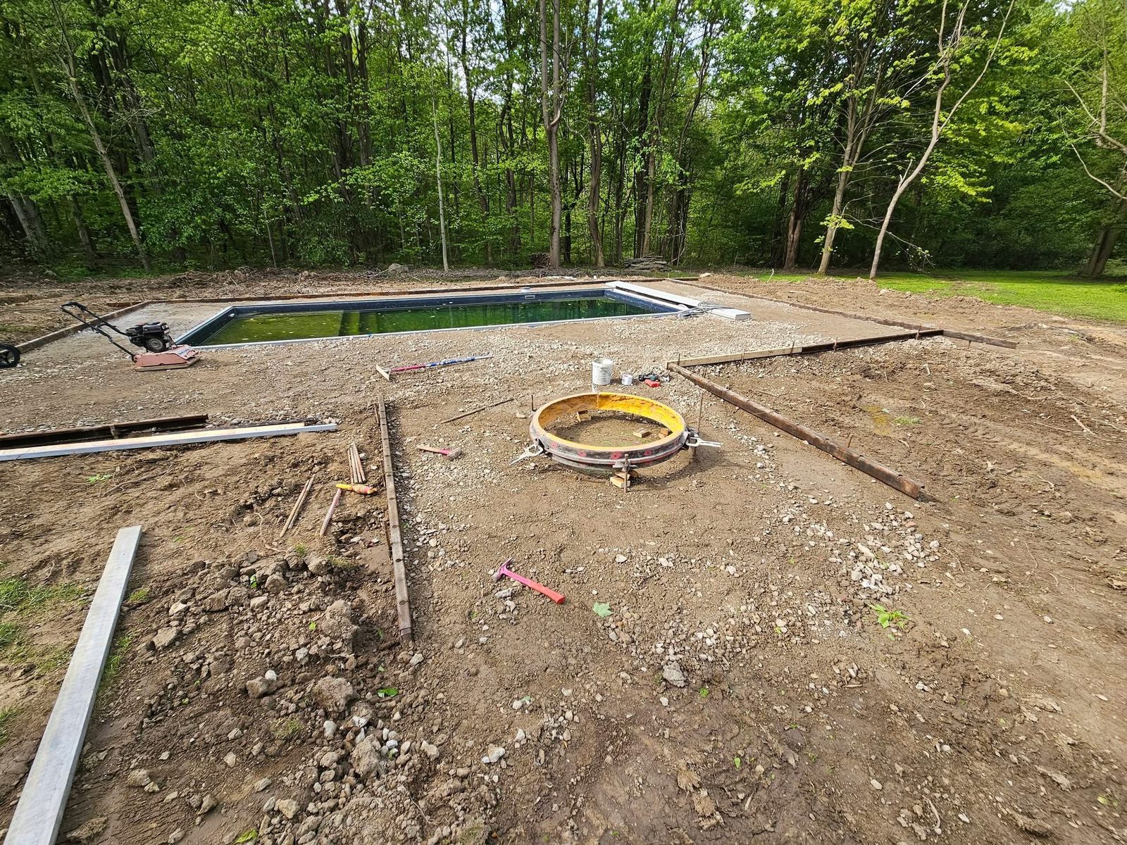Poured concrete pool deck around an in-ground pool
