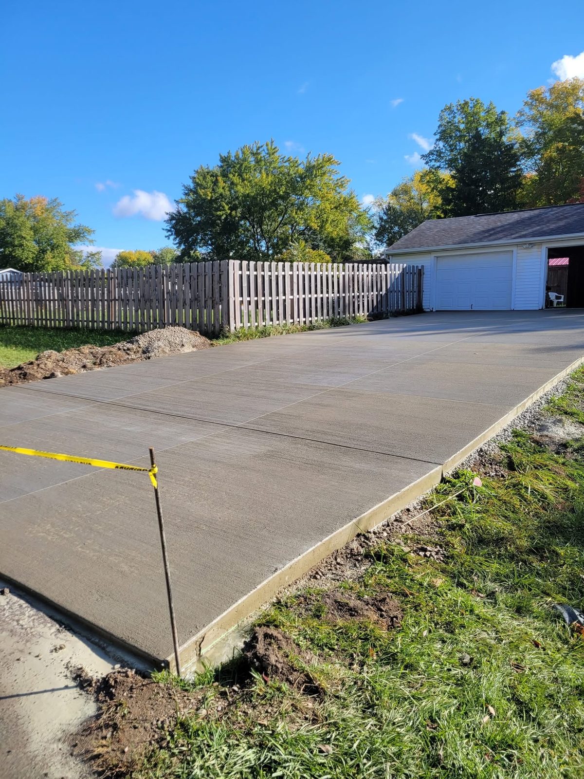 Freshly finished concrete driveway poured by CS & Sons Concrete