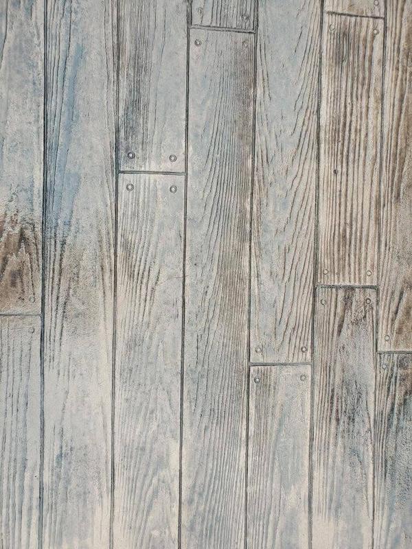 Close-up of wood-plank textured stamped concrete finish