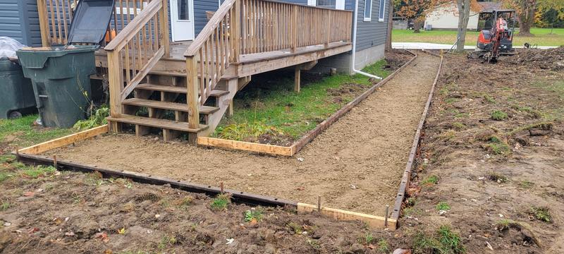 Concrete walkway formed over a compacted base, ready to pour